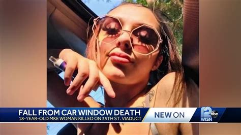 Topless woman killed after hanging out of car window